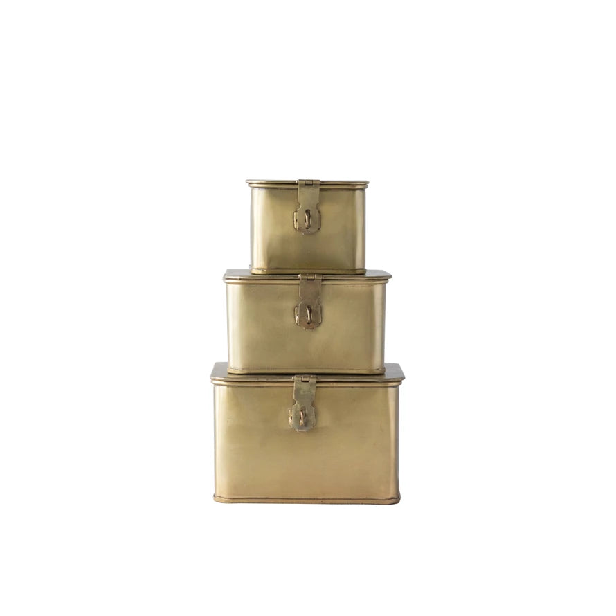 Brass decorative boxes styled on console